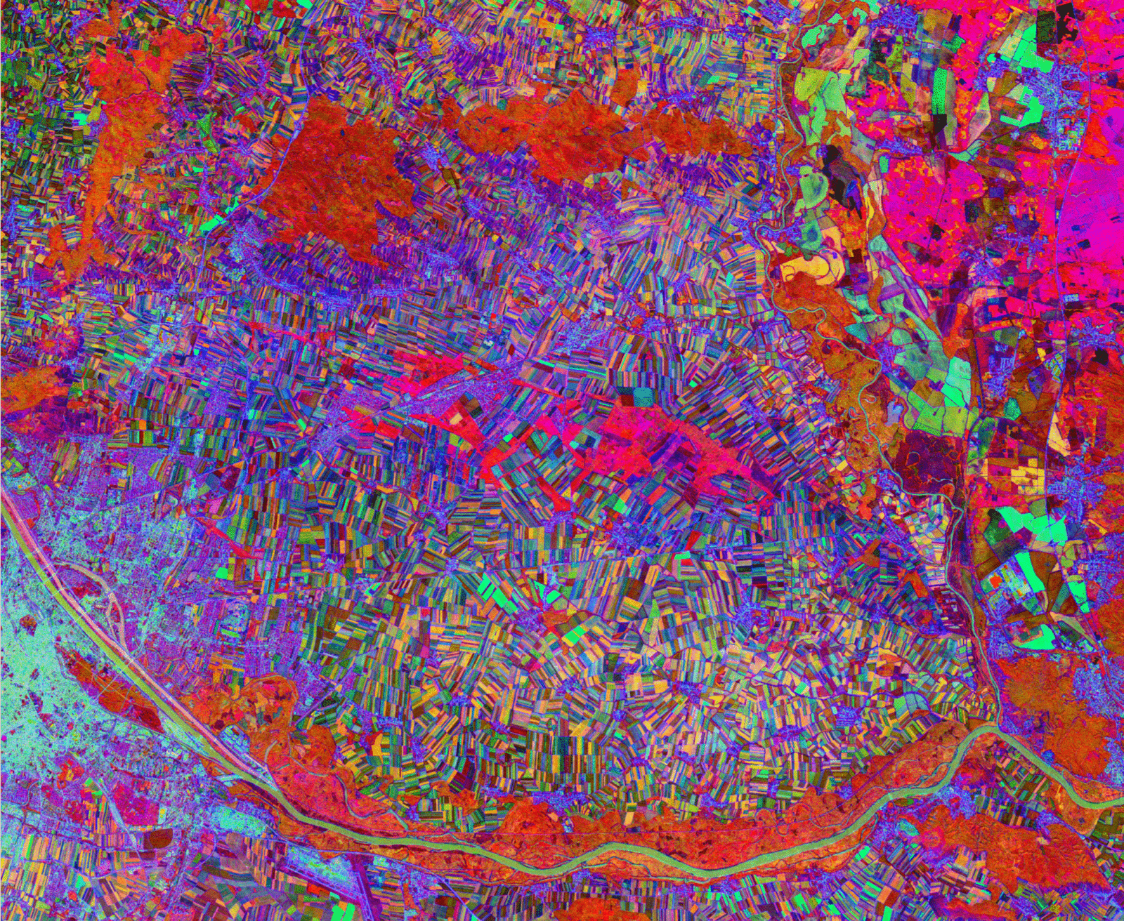 A false-colour TESSERA embedding visualization of a landscape, showing fields, roads, rivers, and settlements rendered in vivid reds, purples, greens, and pinks