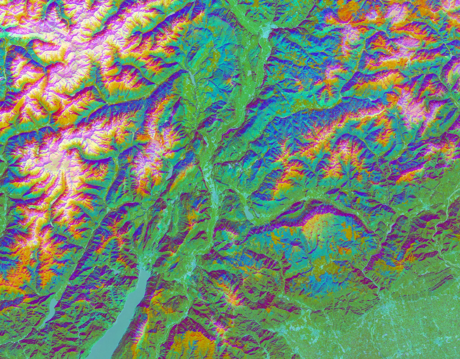 A false-colour Tessera embedding of the mountains of Trentino, Italy, with ridges, valleys and lakes rendered in vivid greens, magentas, oranges and blues